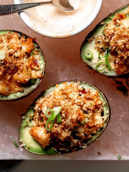 Baked Fish with Prawns and Avocado served on a board