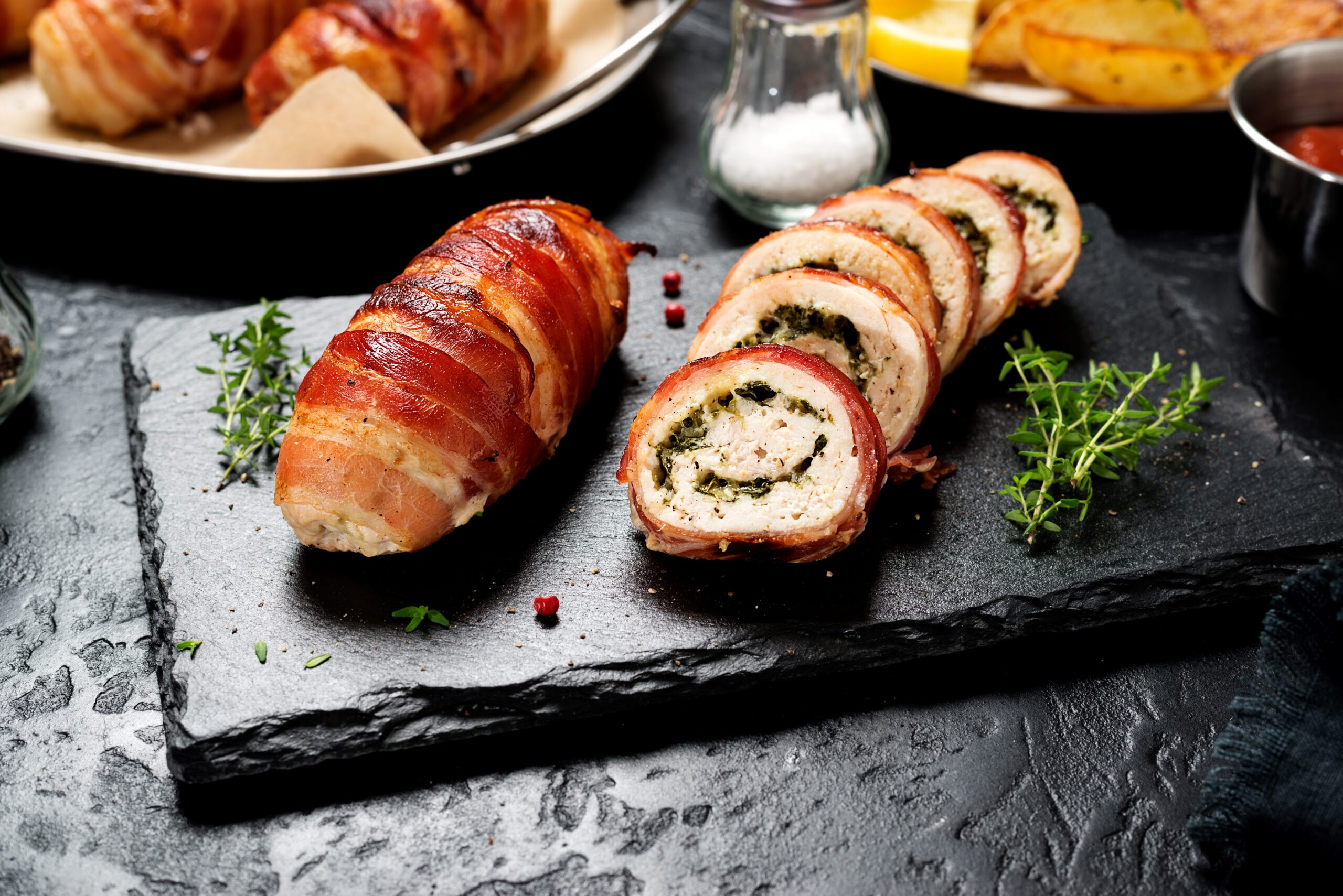 Chicken Stuffed with Cream Cheese served on a slate board