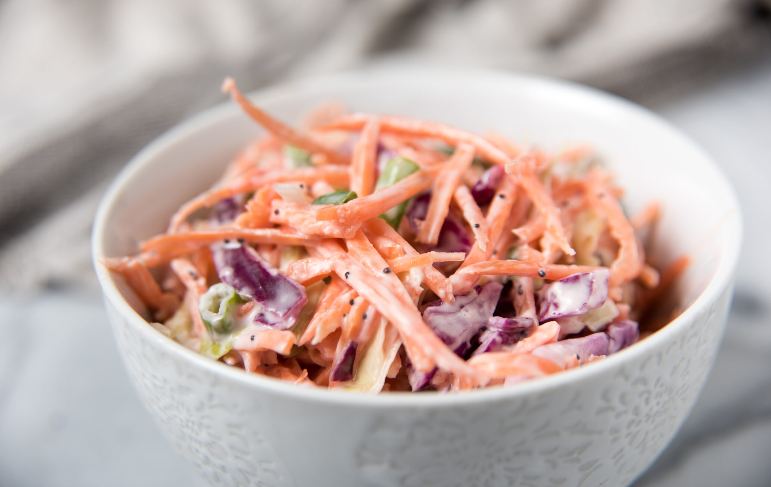 Deli Coleslaw served in a white bowl