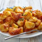 Killer Roast Potatoes served on a white plate