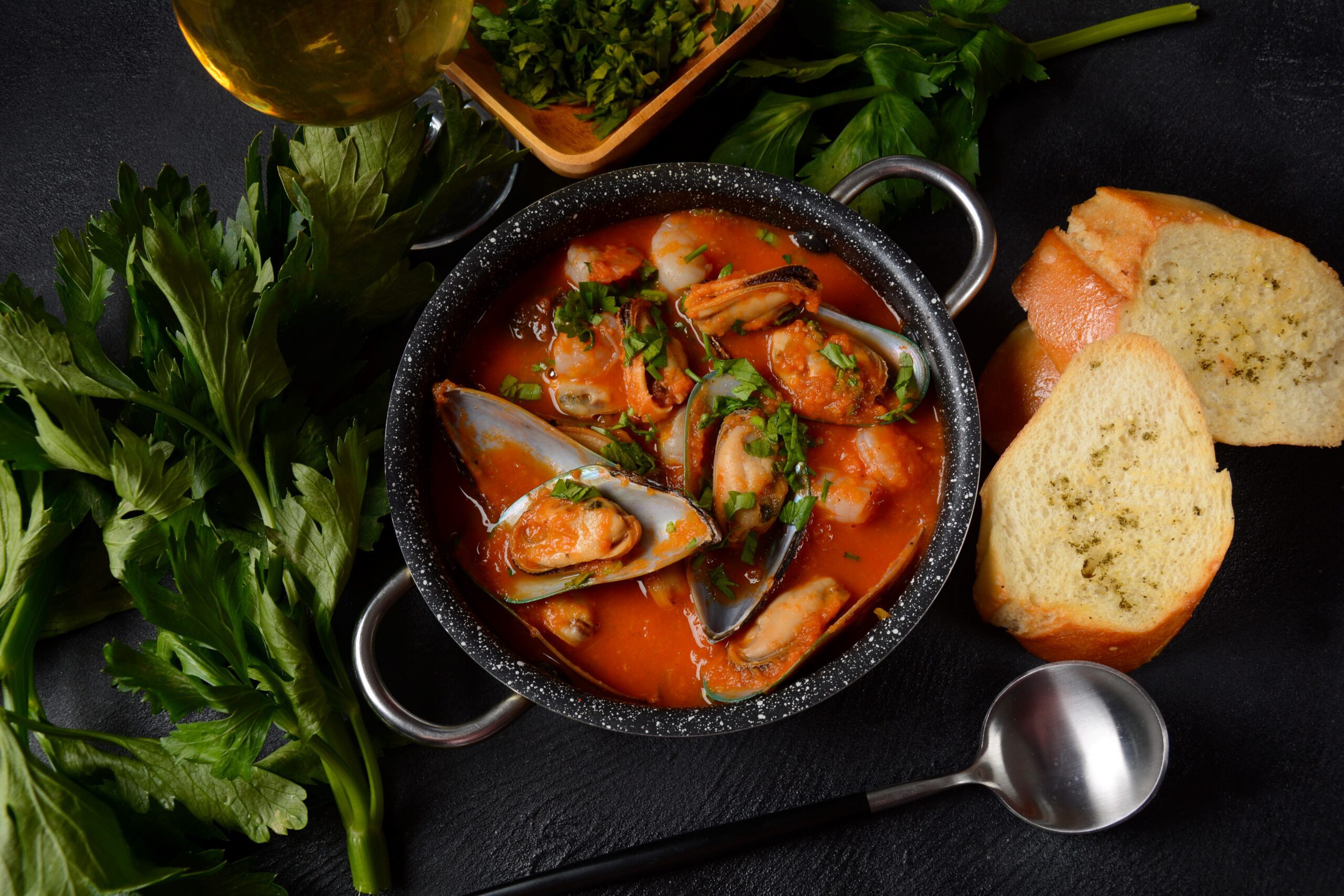 Mussel and Tomato soup; served with sliced bread