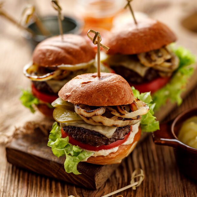 Nice 'n' Spicy Beef Burgers served on a wooden board