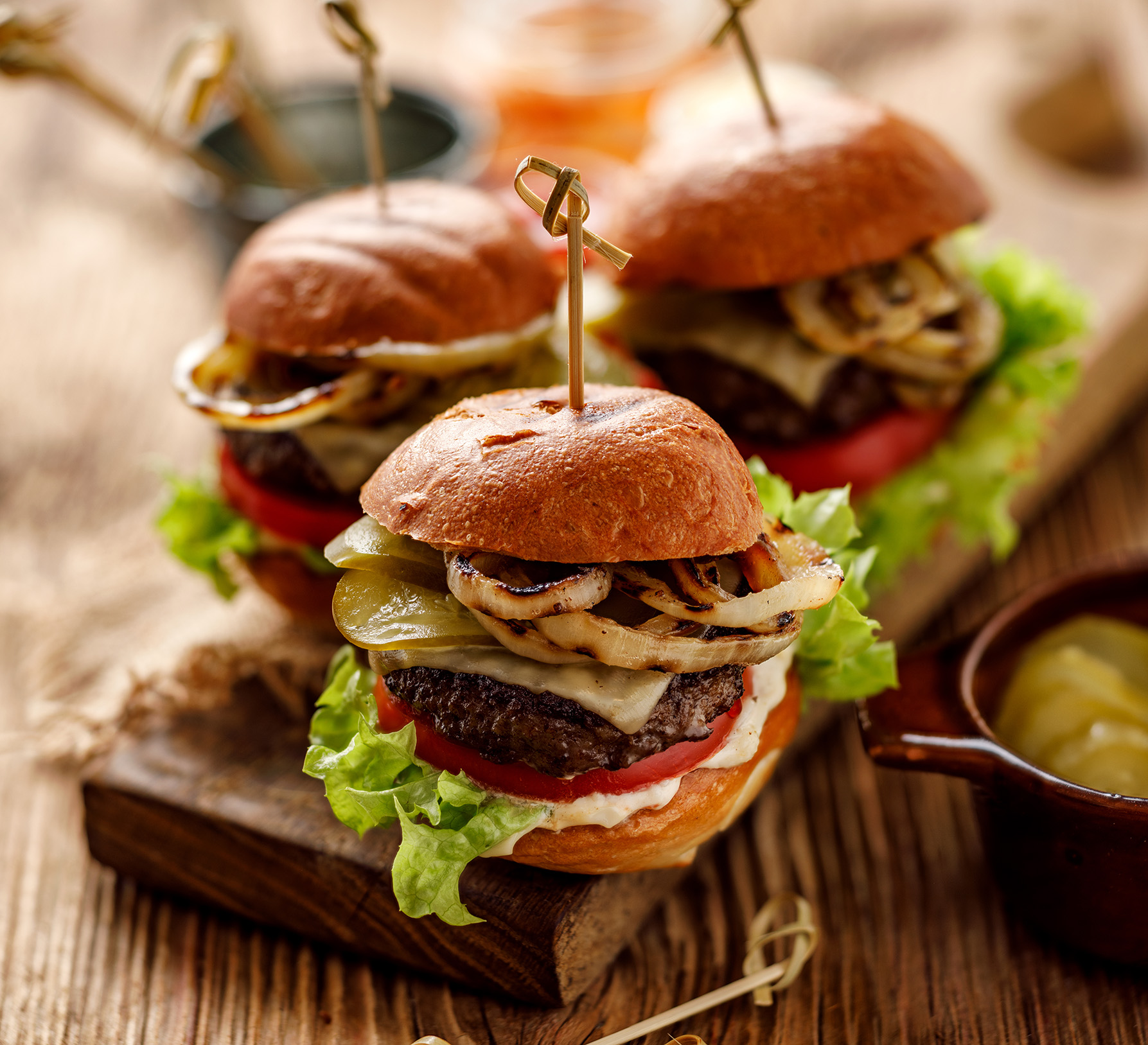 Nice 'n' Spicy Beef Burgers served on a wooden board