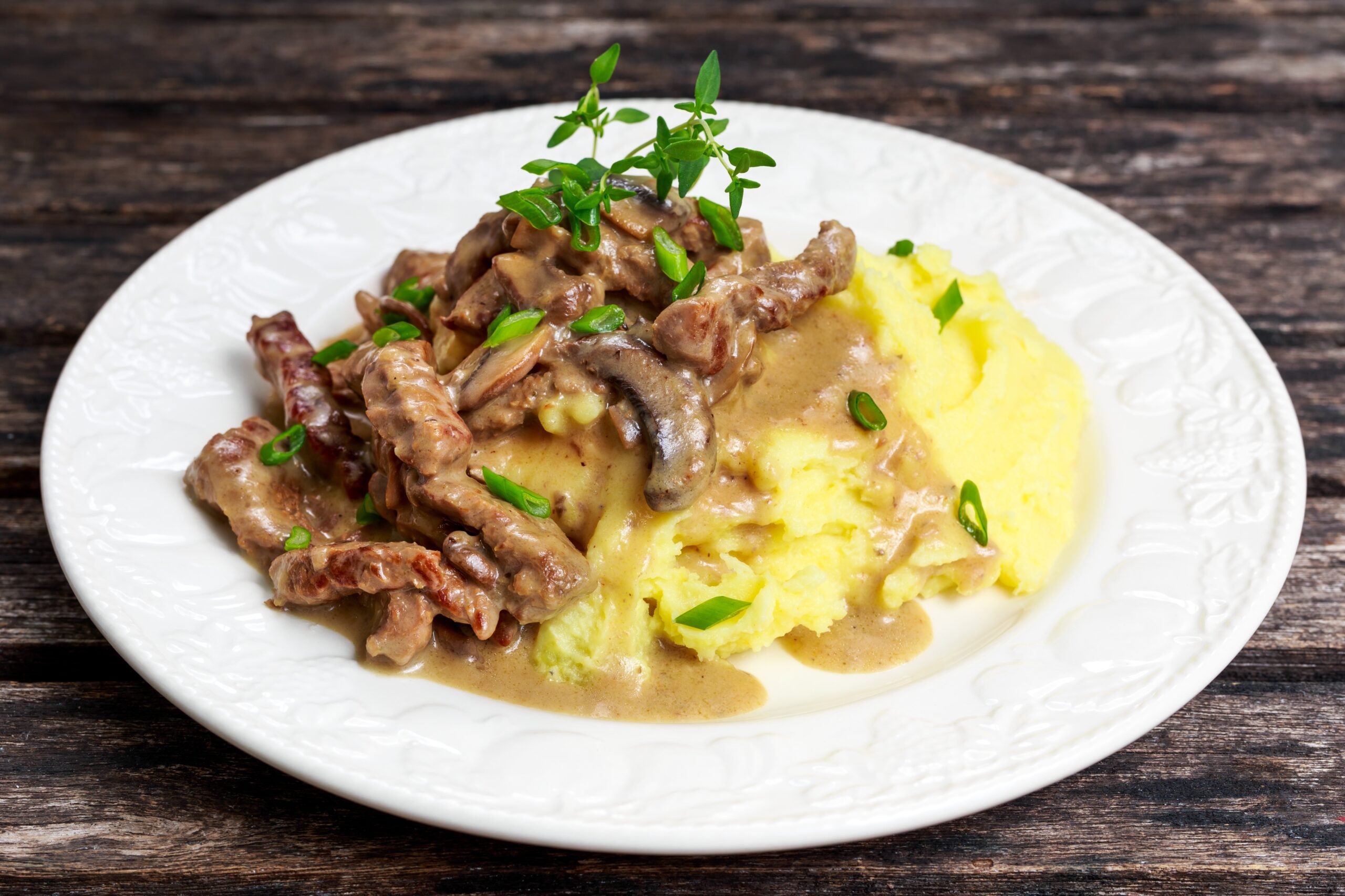 Pork Stroganoff served on a white plate