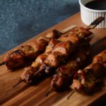 Yakitori Chicken skewers served on a wooden board