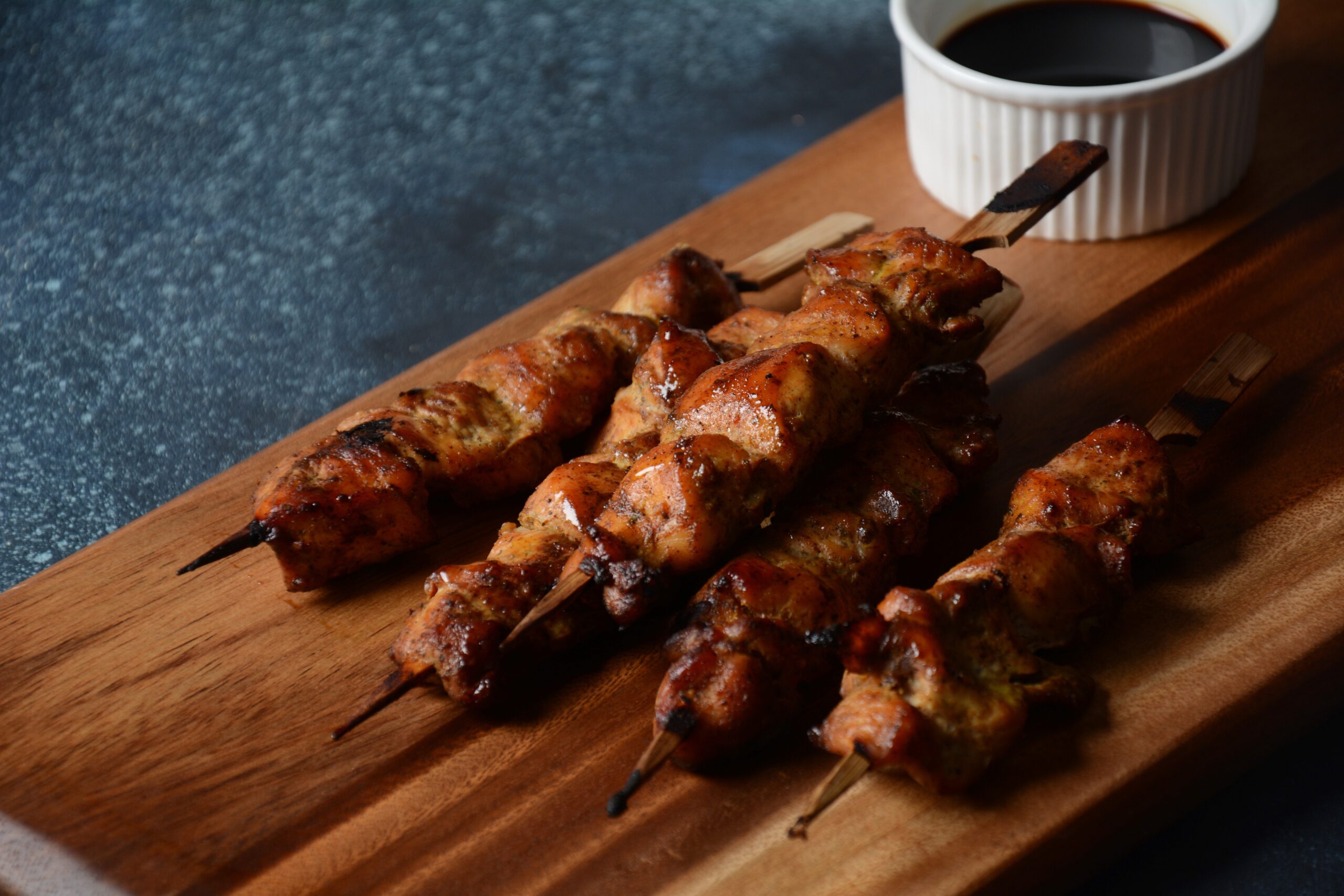 Yakitori Chicken skewers served on a wooden board